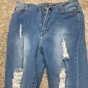 Blue stretchy skinny jeans with rips